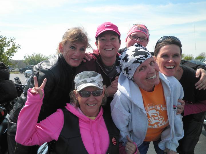 Six Lady Cruisers smiling together, one giving a peace sign