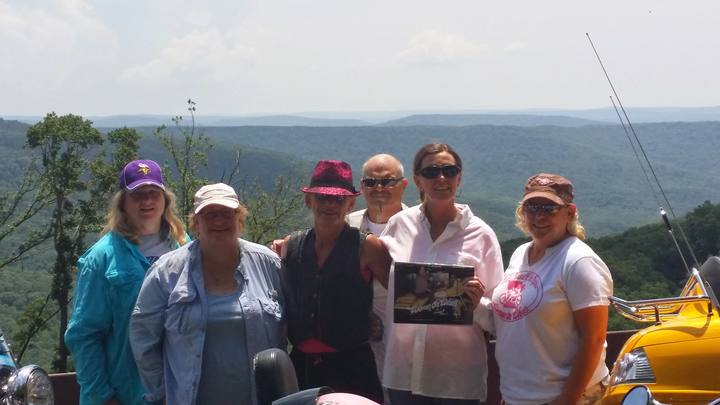 Members standing at a mountain overlook on the Pig Trail ride