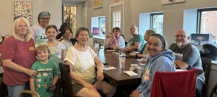 Riders seated around tables at the August 2024 ride to lunch