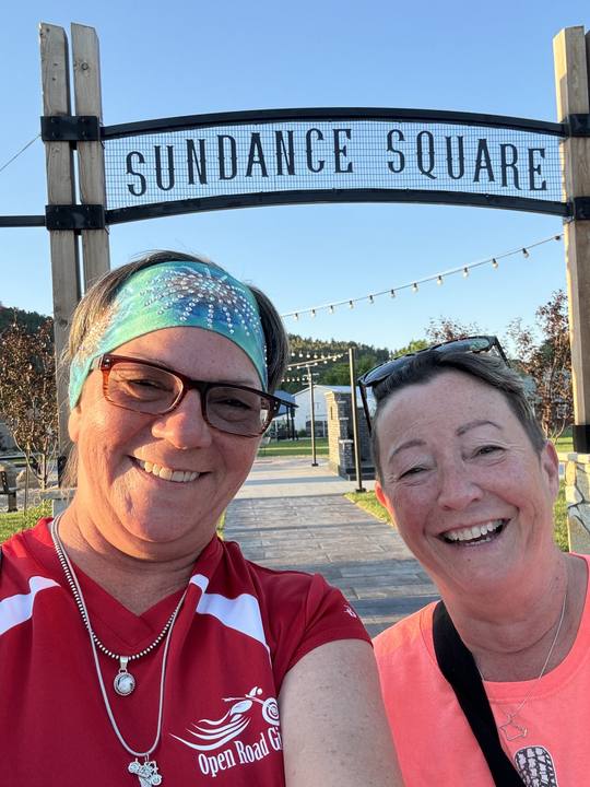 Debi and Deana smiling at the camera in Sundance, Wyoming