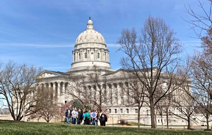 Riders gathered on the lawn in front of the Missouri State Capitol